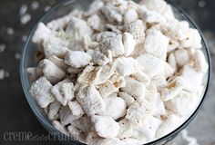 a glass bowl filled with sugar cubes on top of a table