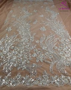 Price: The price is for 1 yard, if you buy more than 1 yard ,it wont be cut. in one piece the longest is 15 yards. we also make wholesale,it starts 15 meters.if you want wholesale contact me. Material: polyester/beads Fixed Wide : 120cm or 47 inches. color:Off white Want to see other colors and more similar beaded fabrics come to: Shipping: Choose the shipping way you need Use for Dress,clothing and some others Rim: as picture Beaded Lace Gown, Off White Wedding Dresses, Lace Trees, Embroidered Wedding Dress, White Lace Wedding Dress, Bridal Lace Fabric, Lace Fabrics, Silver Lace, Wedding Fabric