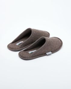 Description: The Le Clare men's Stella in brown is the classic "hotel slipper" reimagined in luxurious boiled wool. This quintessential slipper provides delicate comfort and has been handcrafted, only for the most discerning, the Stella will not disappoint. Featuring our premium Italian boiled wool fiber, the slipper gently conforms to your foot for cozy comfort. The natural elasticity of our wool bounces back to its original shape, giving the slipper lasting appeal with a customized fit. This m Brown Indoor Slippers For Winter, Classic Slip-on Indoor Slippers, Brown Wool Slippers With Round Toe, Classic Winter Slippers With Rubber Sole, Casual Brown Wool Slippers, Comfortable Wool Slip-on Slippers, Brown Soft Slip-on Slippers, Soft Brown Slip-on Slippers, Comfortable Brown Wool Slippers