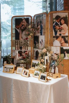 a table with pictures and flowers on it