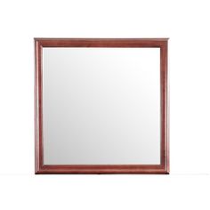 a wooden framed mirror on a white wall