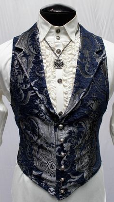 "A Victorian gentleman's vest with class. Great for formal occasions, can be worn under a suit jacket or by itself. Made in rich silver on black tapestry fabric with black satin lining and back. This vest has a very flattering tapered fit and ties in back with satin belting so it can be made tighter in the waist. Fastens in front with six metal buttons. A notched collar adds extra style. Comes in sizes small-3X. Smooth! Size small = chest 39\" waist 36\" Size medium = chest 42\" waist 38\" Size Aristocrat Vest, Victorian Men, Victorian Gentleman, Victorian Man, Idee Cosplay, Victorian Clothing, Mens Vests, Fantasy Clothing, Fantasy Fashion