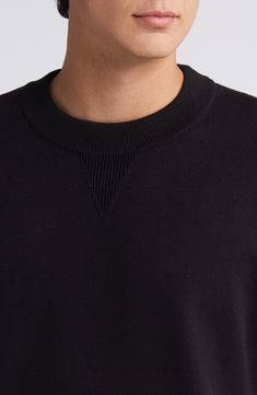 Hallmarks of your gym-class fave like a V-insert at the neckline and dropped shoulders bring a sporty, relaxed vibe to this cotton sweater. Crewneck Long sleeves with ribbed cuffs 100% cotton Machine wash, dry flat Imported Classic Crew Top With Ribbed Collar, Modern Black Sweater With Ribbed Collar, Black Cotton Sweater With Ribbed Neckline, Modern Sweater With Ribbed Cuffs For Streetwear, Crew Neck Sweater With Ribbed Waistband For Layering, Modern Tops With Ribbed Crew Neck, Stretch Sweatshirt With Ribbed Crew Neck, Stretch Crew Neck Sweatshirt With Ribbed Neckline, Modern Crew Neck Sweater