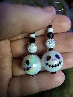 Skeleton drop earrings with black and white beads, Perfect for halloween Homemade Halloween Earrings, White Drop Earrings With Black Beads, White Dangle Jewelry With Black Beads, Gift White Beaded Earrings With Black Beads, White Halloween Party Jewelry, White Spooky Earrings For Party, Spooky White Earrings For Party, White Drop Earrings For Halloween, Novelty White Dangle Earrings