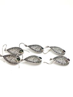 "Intricately detailed sterling silver Bali teardrop earrings with a pear-shaped semi-precious stone at the bottom measures 1 3/4\" in length from the top of the ear wire and 5/8\" in width at its widest point. The pear-shaped stone measures 1/8\" in width and 3/16\" in length. Earrings are rhodium plated over sterling silver so as to prevent tarnishing." Sterling Silver Intricate Teardrop Earrings, Sterling Silver Teardrop Earrings With Intricate Design, Sterling Silver Filigree Teardrop Earrings, Ornate Sterling Silver Teardrop Earrings, Silver Oval Teardrop Pierced Earrings, Handmade Ornate Teardrop Earrings, Bali Earrings, Filigree Earrings, Citrine Stone