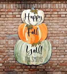 three pumpkins are stacked on top of each other with the words happy fall y'all