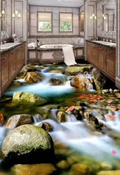 a bathroom with a river running through it and rocks on the ground in front of the tub