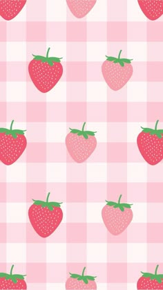 strawberries on a pink checkered tablecloth