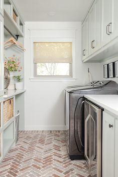 a washer and dryer in a small room