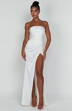 Make an entrance in Safiya, our sleek satin maxi gown that hugs the body in all the right places. Designed with a hidden corset to cinch the waist, the dress features a strapless cut, drape detail to the bust and a thigh high split. Wear yours with a high knot, long mesh gloves and simple mule heels.



Colour: Ivory. 

Luxury heavy stretch satin. 

Thigh high split. 

Body hugging fit. 

Hidden corset. 

Drape detail. 

Strapless cut. 

Maxi length.

Model is a size XS and is wearing an XS. Babyboo Fashion, Homecoming Dresses Corset, White Dress Spring, Midi Dress Wedding Guest, Long Sleeve Homecoming Dresses, Mesh Gloves, Mule Heels, Maxi Dress Sale, Maxi Gown