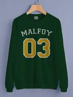 a green sweatshirt with the name malfoy 00 on it hanging on a hanger