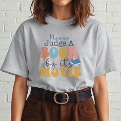 The unisex soft-style Book Lover T-Shirt puts a fresh spin on casual comfort. Made from very soft materials, this tee is 100% ring-spun cotton for solid colors, while heather colors and sport grey include polyester for added flexibility. The lightweight fabric (4.5 oz/yd²) makes this shirt a bliss to wear year-round, whether you're cozying up with a book or heading out for a casual day. Product Features: 100% ring-spun cotton (solid colors) Heather and sport grey colors contain polyester Lightwe Books And Coffee, Book Clubs, Book Enthusiast, Reading Shirts, Literary Gifts, Coffee Shirt, Top Books, Graphic Top, Coffee Shirts