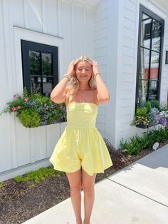 Smocked tube top romper featuring a back zipper and ruching. Material: Rayon/Polyester Model is 5'4" and wears a size small Yellow Romper Outfit, Tube Romper, Recruitment Outfits, Yellow Romper, Romper Outfit, Ruffle Romper