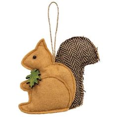 a squirrel ornament hanging from a string