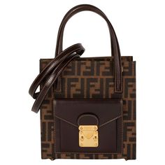 Fendi Brown Zucca Canvas & Calfskin Leather Vintage Shoulder Tote Product Details Xupes Ref: HB4367 Brand: Fendi Model: Shoulder Tote Type: Shoulder, Tote Serial Number: 0914547982 Accompanied By: Fendi Shoulder Strap Colour: Brown Hardware: Gold Material(s): Canvas, Calfskin Leather Specification Height: 21cm Width: 20cm Depth: 9.5cm Handle Drop: 11cm Additional Strap Drop: 51cm Interior: Brown Textile Closure: Button Country of Origin: Italy Authenticity Details: Date Stamp Condition Condition Rating: Excellent Exterior Condition: The exterior is excellent condition with light signs of use. Interior Condition: The interior is in excellent condition with light signs of use. Hardware Condition: The hardware is in very good condition with light signs of use. Corner Condition: The corners ar Fendi Crossbody Bag, Fendi Shoulder Bag, Fendi Vintage, Date Stamp, Vintage Fendi, Vintage Shoulder Bag, Studded Leather, Shoulder Tote, Fashion Handbags