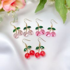 "This listing is for a pair of light pink, pink, or red cherry charm earrings with gold plated stainless steel hooks. Great for sensitive ears! Earrings are about 2\" in total length x 7/8\" wide." Cherry Colored Earrings For Summer Party, Cherry Color Earrings For Summer Party, Handmade Red Earrings For Spring, Red Spring Earrings, Trendy Rose Gold Drop Earrings, Trendy Spring Jewelry Gift, Trendy Spring Jewelry As Gift, Trendy Spring Gift Jewelry, Cute Red Jewelry For Spring