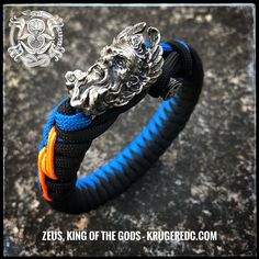 Detailed bead of Zeus, the Greek King of the Gods, ruler of heaven, with the lightning in his hands. Your choice of bead in white brass, oxidized or gold colored. Single or dual colored eccentric fishtail with lightning stitch and original bar closure. Adjustable Blue Oxidized Finish Jewelry, Handmade Ceremonial Blue Jewelry, Handmade Black Jewelry For Blessing, Handmade Blue Jewelry For Blessing, Weave Colors, Paracord Armband, Blue Orange White, Stylish Hoodies, Oxidized Brass