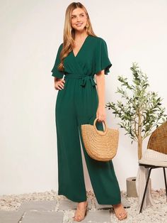 This sublime Butterfly Sleeve V Neck Wide Leg Jumpsuit is the perfect choice for an undeniably chic look. Featuring beautiful butterfly sleeves and a wide-leg design crafted from a vibrant green fabric with a knot tie in front to flatter your figure, this luxury jumpsuit radiates sophistication and stylish elegance. Features: Style: Elegant Pattern Type: Plain Type: Wide Leg Details: Belted, Wrap, Zipper Length: Long Fit Type: Regular Fit Neckline: V neck Sleeve Length: Short Sleeve Sleeve Type: Spring Green V-neck Jumpsuits And Rompers, Green V-neck Jumpsuits And Rompers For Spring, Green V-neck Jumpsuit For Work, Chic Green V-neck Jumpsuit, Green Solid Color Jumpsuits And Rompers For Vacation, Elegant Green Spring Jumpsuits And Rompers, Green Tie Waist Jumpsuits And Rompers For Spring, Green Short Sleeve Jumpsuits And Rompers For Work, Summer Green Belted Jumpsuits And Rompers