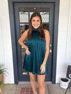 This dress is perfect for any occasion. Constructed with an all-over pleated design and a halter neck with a tie detail, it is both stylish and comfortable. Lined with satin, it is sure to be a go-to in your wardrobe. Thais is wearing a size Medium. Height is 5’10, Bust is 34”, Waist 27”, and Hips 38”. Satin Dress With Pleated Back For Date Night, Satin Dress With Pleated Back For Night Out, High Neck Satin Dress For Date Night, Satin High Neck Dress For Date Night, Spring Date Night Satin Halter Dress, Spring Satin Halter Dress For Date Night, Chic Halter Neck Satin Dress For Summer, Chic Pleated Satin Mini Dress, Spring Satin Pleated Dress