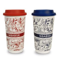 two coffee cups with different designs on them, one is blue and the other is red