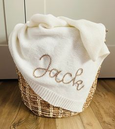 a white towel sitting on top of a basket