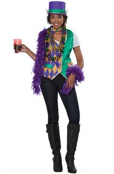 a woman in a mardi gras costume holding a drink