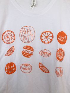 Hand Drawn and Hand Printed! This is a screen printed boxy tee crop top with a variety of hand drawn citrus- oranges and grapefruit! The shirt shown here is white and is printed in orange ink. // PROCESS: All of our items are individually hand printed by either me or my dad, which can lead to slight variations in placement. The ink is heat cured and will not fade over time. Since our items are printed to order, there is a 1-2 week processing time before shipping. If you absolutely need an item s Cheap Graphic Tee With Fruit Print, Cheap Fruit Print Tops For Summer, Cheap Relaxed Fit Fruit Print Tops, Cheap Fruit Print Short Sleeve T-shirt, Cheap White T-shirt With Fruit Design, Cheap White T-shirt With Fruit Print, Cheap Trendy Tops With Fruit Design, Cheap Casual Fruit Print T-shirt, Cheap Short Sleeve T-shirt With Fruit Design