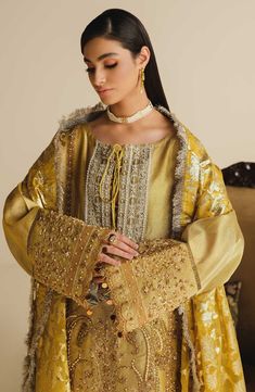 Yellow Long-sleeved Raw Silk Salwar Kameez, Gold Long Sleeve Dresses For Diwali, Gold Sharara With Chikankari Embroidery, Gold Dresses With Zari Work, Gold Sets For Eid, Jamawar Sets With Zari Work, Traditional Long Sleeve Wear With Intricate Embroidery In Chinon, Gold Long Sleeve Semi-stitched Dress, Eid Dabka Work Embroidered Fabric