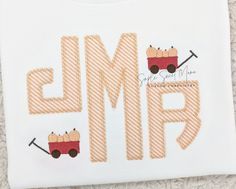 a white t - shirt with the word emo embroidered on it