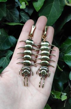 Ear weights with movable centipede pendants made entirely of brass. You can choose whether you want two head sections, two back sections or one head and one back section. The clasps are suitable for ear holes stretched to at least 5mm when not wearing jewelry such as tunnels. Since these weights are made of untreated (raw) brass, they darken slightly over time, but can be polished up again at any time with the included polishing cloth. single = 1 weight pair = 2 weights Dimensions: Total length: Unique Cheap Plug Earrings, Cheap Small Pierced Earrings, Small Stretched Earrings, Cheap Vintage Metal Plug Earrings, Cheap Brass Plug Earrings, Elegant Handmade Cheap Plug Earrings, Cheap Novelty Plug Earrings, Cheap Bronze Jewelry With Ear Wire, Unusual Jewelry Unique