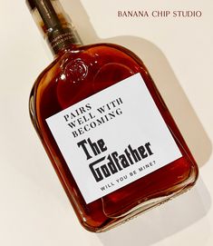 a bottle of the godfatr whisky is shown in front of a white background