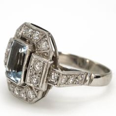 an art deco diamond and blue topaz ring