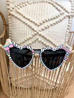 These sunglasses are unique, stylish and just the perfect accessory for the ultimate 80's party.  If you would like a different version of beading or have another idea in mind just message me. I can do whatever you would like.  Return Policy: As these sunglasses are customized products, we do not accept returns or exchanges unless there is a misspelling, we will send a corrected item at no additional charge. Funky Sunglasses With Tinted Lenses For Parties, Funky Tinted Sunglasses For Party, Trendy Plastic Sunglasses For Music Festival, Trendy Plastic Sunglasses For Festivals, Playful Tinted Lens Sunglasses For Festival, Retro Plastic Festival Sunglasses, Retro Plastic Sunglasses For Party, Retro Plastic Sunglasses For Parties, Festival Fun Sunglasses With Mirrored Lenses