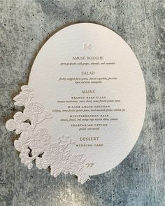 the wedding menu is laid out in white paper