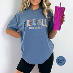 Baseball Mom Squad Shirt, Group Shirts, Baseball Tournament Tees,  Baseball Weekends, Comfort Colors Mama Tshirt For Birthday Gift For Her, Gift to Mama, Baseball Mama Shirt, Sports Moms A fan favorite, the Comfort Colors 1717 tee is crafted from medium-weight, high-quality 100% ring-spun US cotton for enduring comfort. Its relaxed fit offers comfort in both casual and semi-formal settings, while the crew neckline provides a timeless, polished look that is perfect for accessorizing. The pre-shru Sporty Short Sleeve Top With Lettering, Casual T-shirt With Lettering For Game Day, Short Sleeve Graphic Tee With Lettering, Graphic Tee With Lettering And Short Sleeves, Cotton T-shirt With Baseball Season Lettering, Team Spirit Cotton Tops With Lettering, Cotton Tops With Team Spirit Lettering, Blue Letter Print Top For Game Day, Blue Letter Print Tops For Game Day