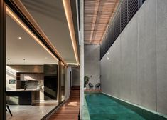 an indoor swimming pool in the middle of a house