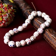 Antique venetian trade beads found in Ethiopia, East Africa. Such old trade beads are originally of Venetian provenance and were transported by merchants and explorers for trade in Africa during the 18th-20th centuries. Individual beads will measure 9-11mm in diameter with  24 beads on a strand. Traditional White Beaded Bracelets With Spacer Beads, Traditional Beaded Bracelets With Polished Oval Beads, Traditional Beaded Bracelets For Healing, Traditional Beaded Bracelet With Large Oval Beads, Traditional Round Wooden Beaded Bracelets, Traditional White Beads For Healing, Vintage Wooden Beads, Traditional White Healing Beads, Traditional Round Wooden Beads