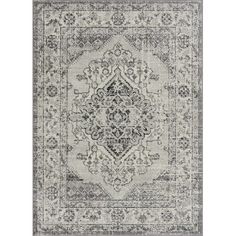 a gray and white rug with an ornate design