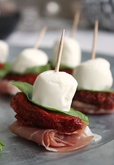 small appetizers with meat and cheese on them