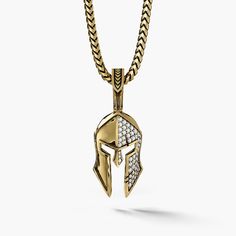 a gold Spartan pendant with half of the helmet covered in diamonds Diamond Pendant With Box Chain, Symbolic Diamond Accents Pendant Jewelry, Symbolic Pendant Jewelry With Diamond Accents, Gold Jewelry With Diamond Accents, Unique Gold Pendant For Men, Mens Gold Pendant, Unique Gold Necklace, Spartan Shield, Gold Pendants For Men