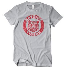 Bayside Tigers T-Shirt Should you have gone to school at Bayside High? Would you have fit in with Zack, Kelly, Slater, Jessie, Lisa and Screech? Would you have felt right at home making Mr. Belding's job as hard as possible? And would you have loved to root for the Bayside Tigers? Well you still can with this awesome tee! More Info Behind The Design Saved by the Bell is an American television sitcom that aired on NBC from 1989 to 1993. The show follows a group of friends and their principal. Pri Volleyball Team Shirts, New Year Eve Movie, Kelly Slater, 90s Men, Saved By The Bell, Tiger T Shirt, Dog Holiday, Group Of Friends, Team Shirts