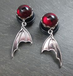 Leetle bat wing plug earrings! Sizes 12g thru 1/2" (larger sizes upon request). https://etsy.me/2YAsT8s  #batwings #bats #halloween #jewelry #handmade #goth #gothicjewelry #spooky #creepy #stretchedears #gaugedearrings #dangleplugs #plugearrings Goth Bride, Weird Earrings, Jewelry Goth, Dangle Plugs, Earrings Gothic, Bats Halloween, Plug Earrings, Aesthetic Grunge Outfit, Bat Wing