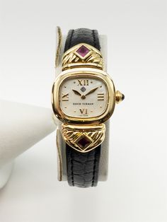 Item Description: VERY Rare David Yurman 18k Yellow Gold Watch...purcahsed in Hong Kong and in solid 18k yellow gold. ALL ORIGINAL with 1ct in Natural SQUARE CUT Burma RUBY. Very cool and rare find. 18k Yellow gold buckle...Retail $10,000. HEAVY high grade watch. WOW!!! Circa 2000...One very rare watch. Band is aftermarket but the watch is all original. Brand: DAVID YURMAN Movement: QUARTZ Metal: 18k Yellow Gold Gram Weight: 32.8 Powered by SixBit's eCommerce Solution Luxury Hallmarked Diamond Watch For Evening, Luxury Hallmarked Diamond Watch For Evenings, Yellow Gold Rectangular Diamond Watch For Evening, Designer Yellow Gold Watches With Polished Finish, Formal Yellow Gold Diamond Watch With Rectangular Shape, Luxury Hallmarked Evening Watches, Luxury Gold Watches Stamped 14k, Evening Yellow Gold Diamond Watch With Rectangular Dial, Timeless Yellow Gold Jewelry And Watches For Formal Occasions