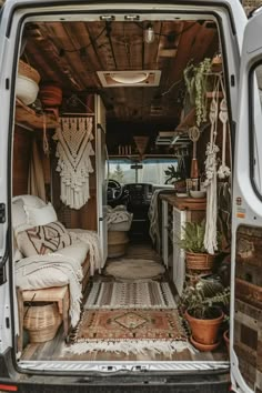 the interior of a van with an area rug on the floor and other items in the back