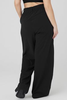 Your wildest trouser dreams just came true. The High-Waist Dreamscape Trouser takes the iconic pleats and silhouette of trousers and takes the look to the next level with lightweight crinkle woven fabric that breathes, moves and sets trends wherever it goes. Layer over a bodysuit or pair with the matching Dreamscape Button Down Long Sleeve! Trouser with lightweight crinkle fabric High waisted with wide leg silhouette Side pockets & faux back welt pockets Designed & uniquely fit to flatter every size Wear-tested by our in-house team for the perfect fit Alo Yoga Relaxed Fit Pants With Elastic Waistband, Versatile Alo Yoga Bottoms, Alo Yoga Wide Leg Casual Bottoms, Versatile Solid Color Alo Yoga Bottoms, Alo Yoga Relaxed Fit Wide Leg Bottoms, Alo Yoga Pants With Elastic Waistband, Alo Yoga Solid Color Pants With Elastic Waistband, Black 4-way Stretch Tapered Leg Pants, Black Tapered Leg Pants With 4-way Stretch