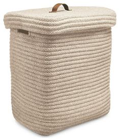 a large gray storage basket with wooden handles