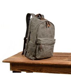 Luxury Vintage Waxed Finish Bag, Casual Backpack For Back To School, Vintage Waxed Canvas Backpack For Everyday, Vintage Everyday Backpack In Waxed Canvas, Vintage Waxed Canvas Everyday Backpack, Vintage Everyday Waxed Canvas Backpack, Vintage Bags For Everyday And Back To School, Casual Everyday Waxed Canvas Backpack, Retro Canvas Backpack