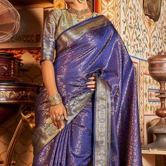 Violet colored saree is prettified with weaving work as shown which makes it appear classy. This saree is made of Kanjivaran Silk fabric which is accompanied with Kanjivaran Silk blouse piece which you can customise as per your design/style. Women can buy this saree to wear for their party, festive and functions, events and ideal for any fashionista. Note:- The actual product may differ slightly in color and design from the one illustrated in the images when compared with computer or mobile screen. Measurements: Saree : KanjiVaram : 5.5 Mtrs Blouse : KanjiVaram Silk : 0.8 Mtr Material: KanjiVaram Silk Stitch Type: Unstitched Country of Origin: India Care Guide: Dry Clean Diwali Pre-draped Saree With Zari Weaving, Designer Handloom Pre-draped Saree For Festivals, Banarasi Silk Pre-draped Saree With Zari Weaving, Designer Handloom Paithani Silk Pre-draped Saree, Self Design Pre-draped Saree For Navratri, Diwali Handloom Pre-draped Saree In Traditional Drape, Katan Silk Pre-draped Saree With Zari Weaving For Navratri, Designer Blue Saree With Traditional Patterns, Eid Handloom Banarasi Silk Saree