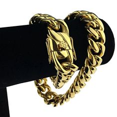 Men's 20" long x 18mm wide Cuban choker. 24k gold plated over solid stainless steel. Chunky cuban chain weighs well over 290 grams - has a premium feel. Stylish, strong and secure box lock clasp. Take your game to the next level with this solid stainless steel chain necklace. 100% FREE SHIPPING in USA. Order now! Cuban Link Bracelet In Stainless Steel With Gold Chain, Gold Chain Cuban Link Bracelet In Stainless Steel, Stainless Steel Cuban Link Bracelet With Gold Chain, Gold Cuban Link Necklace Metal Gift, Gold Metal Cuban Link Necklace As Gift, Gold Metal Cuban Link Necklace For Gift, Gold Stainless Steel Cuban Link Necklace, Gold Stainless Steel Jewelry With Curb Chain, Gold Stainless Steel Curb Chain Jewelry