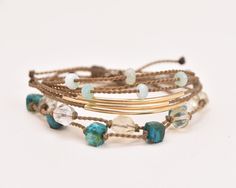 Our just-the-right-amount-of-dainty Tula Blue bracelets are your new everyday obsession. Wear your bracelets on their own for a minimalist moment, or as a stack for a bold statement. You’ll be saying, “Thanks— it’s Tula Blue!” all day long.Not sure where to start your Tula Blue bracelet stack? You’ve come to the right place. Sit back, relax, & let us stack for you! Shop our curated collection of tried & true bracelet stacks.This 'Evergreen' Bracelet Stack includes: 1. Amazonite Faceted Rondelle Riptide ($45)2. 14k Gold Bar Riptide ($75)3. Lemon Quartz Starcut ($45)4. Chrysocolla Cube ($60)- Signature hand-spun Tula Blue ROPE- 100% waterproof, kid-proof, life-proof- One-size-fits-all sliding knot closure for custom fit One more thing: Due to the one-of-a-kind nature of our materials, colors Blue Stackable Friendship Bracelets For Everyday, Minimalist Stacked Adjustable Jewelry, Minimalist Hand Wrapped Adjustable Jewelry, Adjustable Stacked Bangle Bracelets, Adjustable Stacked Beaded Bracelets For Everyday, Minimalist Stackable Bracelets For Everyday, Adjustable Dainty Bracelets For Everyday Wear, Dainty Adjustable Bracelets For Layering, Dainty Adjustable Everyday Bracelets